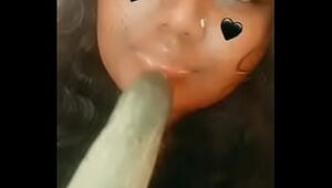 some ugly indian female deepthroating a cucumber
